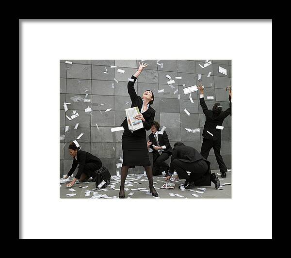 Young Men Framed Print featuring the photograph Business people on pavement catching falling money by Michael Blann