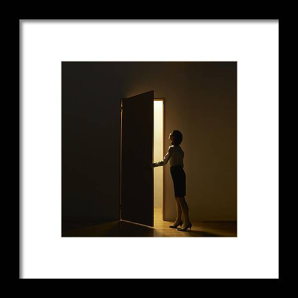 People Framed Print featuring the photograph Business Woman Opening Door Standing In Light by D-base