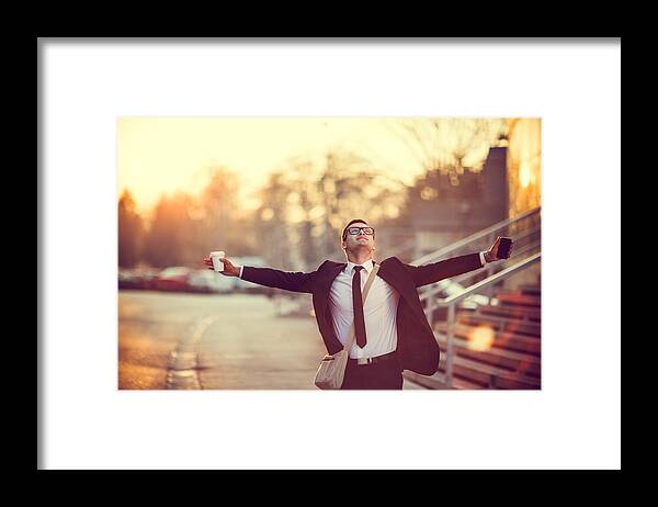 Expertise Framed Print featuring the photograph Businessman smiling with arms outstretched by Eclipse_images