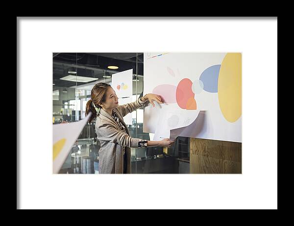 Expertise Framed Print featuring the photograph Businesswoman leading presentation in conference room by Sunwoo Jung