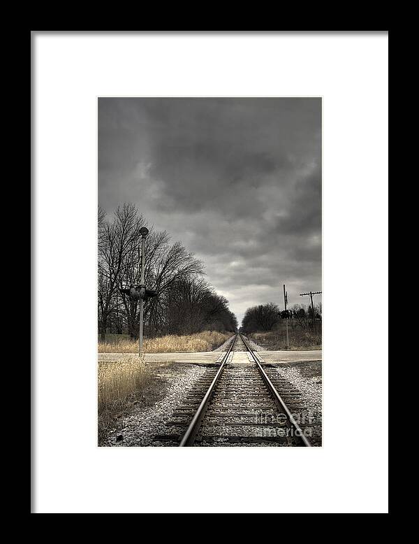 Rail; Railroad; Tracks; Train Tracks; Barren; Empty; Rocks; No One; Metal; Line; Iron; Ties; Gravel; Transportation; Stone; Pebbles; Rural; Vanishing Point; Outside; Outdoors; Route; Brush; Grasses; Trees; Old; Road; Signal; Lights; Crossing Gate; Sign; Crossing; Sky; Cloudy; Storm; Grey; Dark; Darkness; Ominous; Autumn; Fall; Transportation Framed Print featuring the photograph By Train by Margie Hurwich