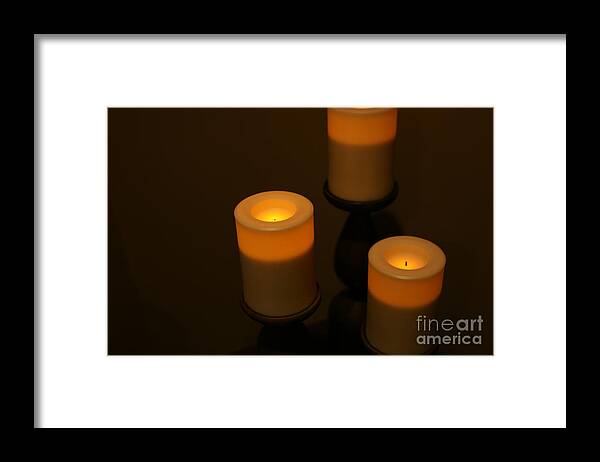Three Candles Framed Print featuring the photograph Candle Shine by Stan Reckard