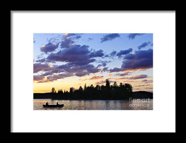 Sunset Framed Print featuring the photograph Canoeing at sunset by Elena Elisseeva