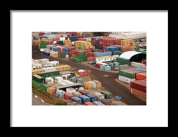 Freight Transportation Framed Print featuring the photograph Cargo Containers In A Freight Yard by Tobias Titz
