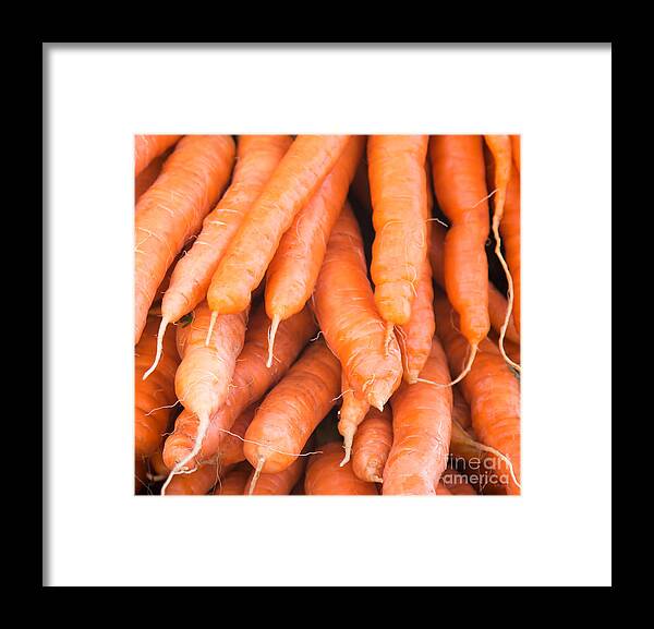 Carrots Framed Print featuring the photograph Carrots by Rebecca Cozart