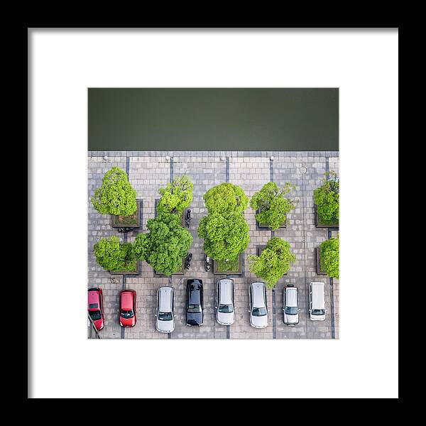 In A Row Framed Print featuring the photograph Cars On A Parking Lot by Chinaface