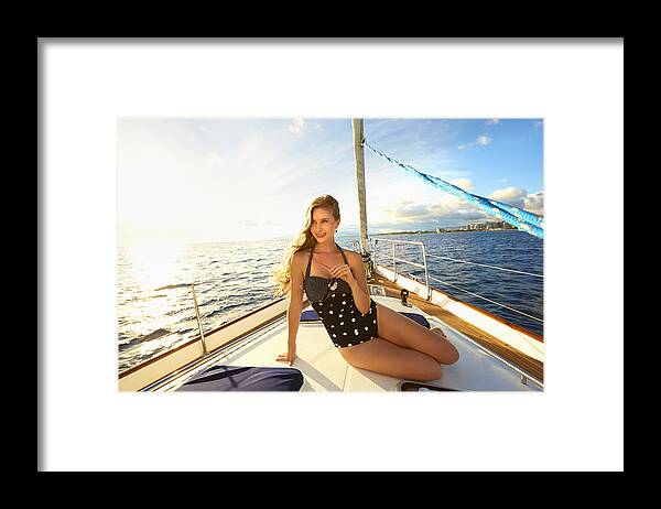 Honolulu Framed Print featuring the photograph Caucasian woman sitting on yacht deck by Colin Anderson Productions pty ltd