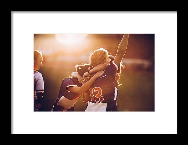 Soccer Uniform Framed Print featuring the photograph Celebrating the victory after soccer match! by Skynesher