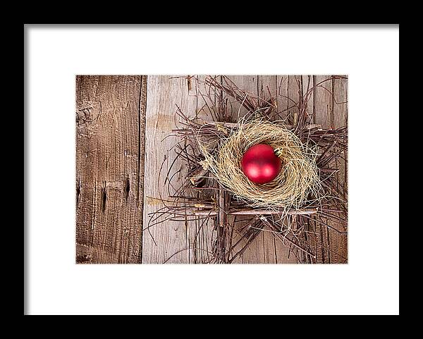 Background Framed Print featuring the photograph Christmas ornament in a nest by Jennifer Huls