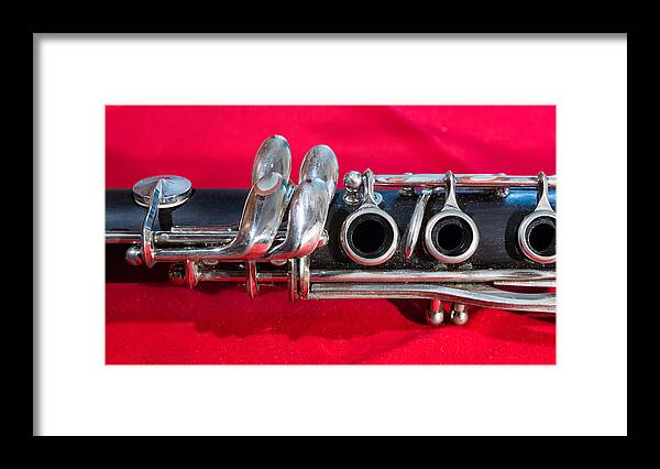 Clarinet Framed Print featuring the photograph Clarinet on Red by Photographic Arts And Design Studio