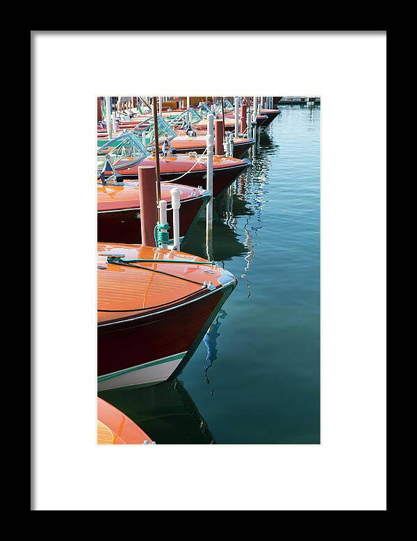 In A Row Framed Print featuring the photograph Classic Wooden Boats by Jenniferphotographyimaging