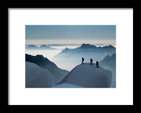 Young Men Framed Print featuring the photograph Climbing Team On A Snowy Ridge by Buena Vista Images