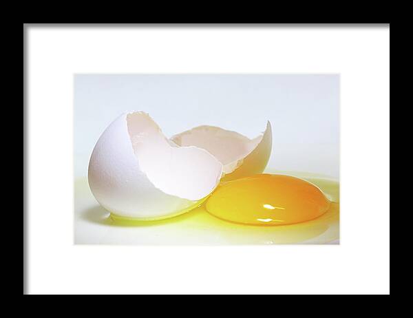 White Background Framed Print featuring the photograph Close-up Of A Broken Egg On White by Zen Rial