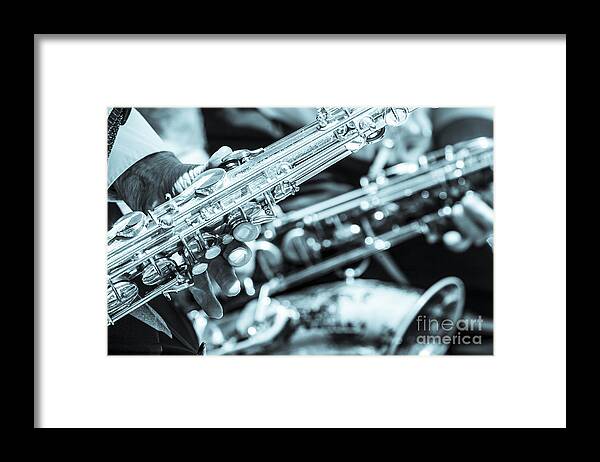 Brass Framed Print featuring the photograph Close Up Of Saxophonist Fingering by Peter Noyce