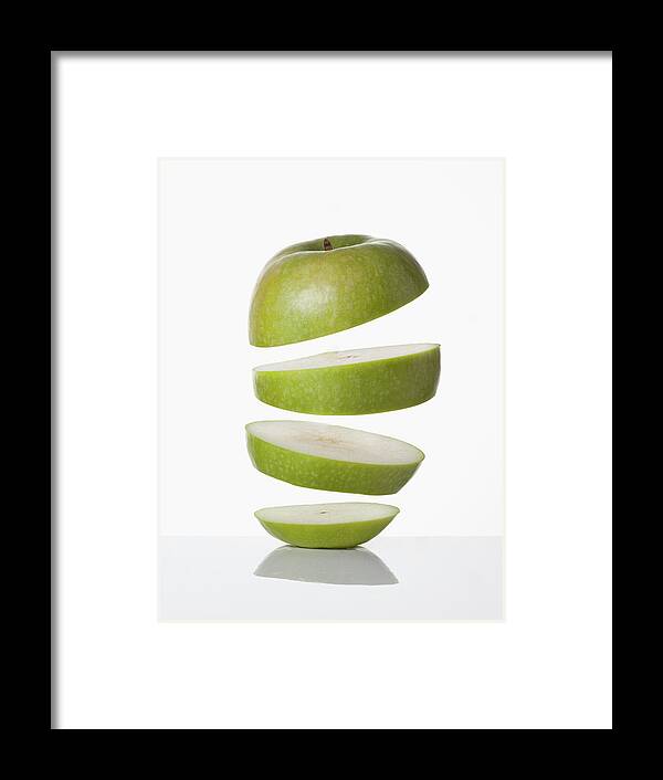 Concepts & Topics Framed Print featuring the photograph Close Up Of Slices Of Apple by Walter Zerla
