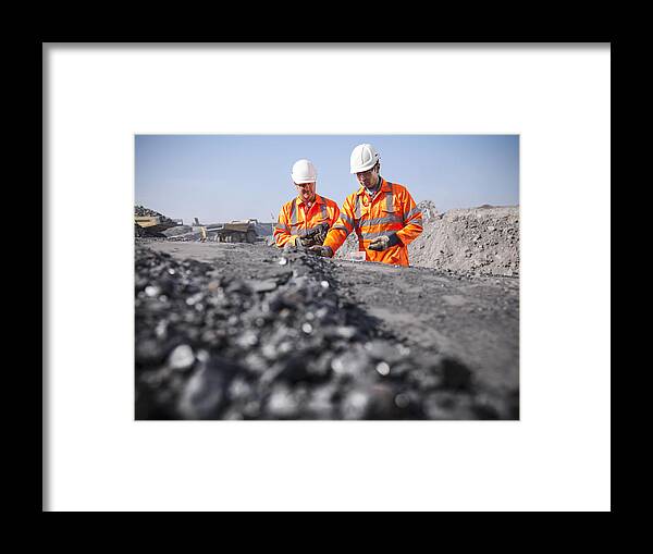Working Framed Print featuring the photograph Coalminers inspecting coal in an opencast colamine by Monty Rakusen