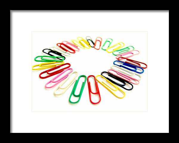 Curve Framed Print featuring the photograph Colorful office clips arranged in a circle in a white background by Blanchi Costela