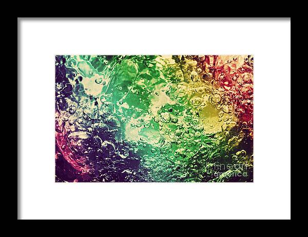 Water Framed Print featuring the photograph Colorful splashing pouring water with bubbles by Michal Bednarek