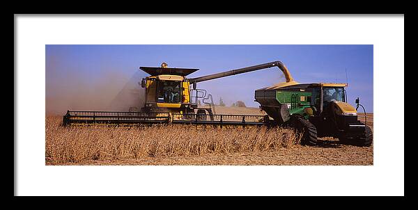 Photography Framed Print featuring the photograph Combine Harvesting Soybeans In A Field by Panoramic Images
