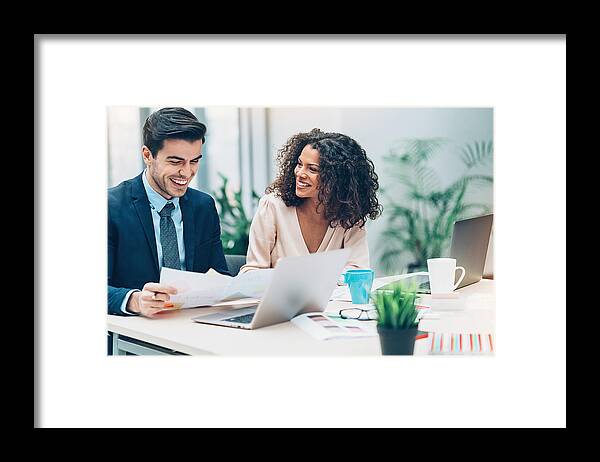 Expertise Framed Print featuring the photograph Couple of business persons on a meeting by Pixelfit