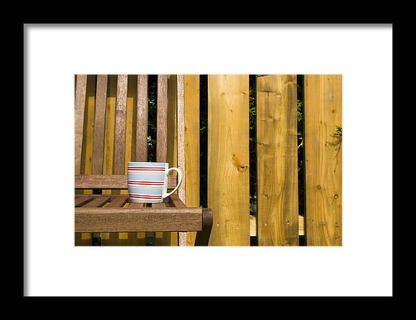 Chair Framed Print featuring the photograph Cup on garden chair by Jim Orr