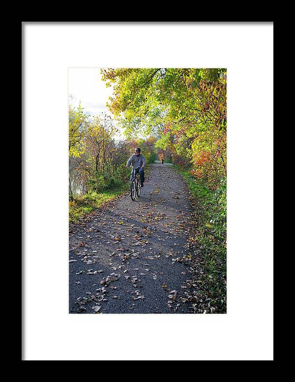 Human Framed Print featuring the photograph Cyclist In Parkland In Autumn by Jim West