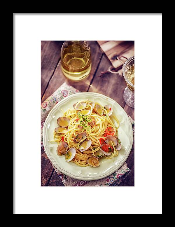 Italian Food Framed Print featuring the photograph Delicious Spaghetti Alla Vongole Served by Gmvozd