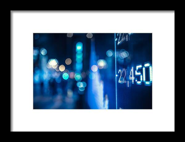 Financial Figures Framed Print featuring the photograph Display Stock Market Numbers And Graph by Nikada