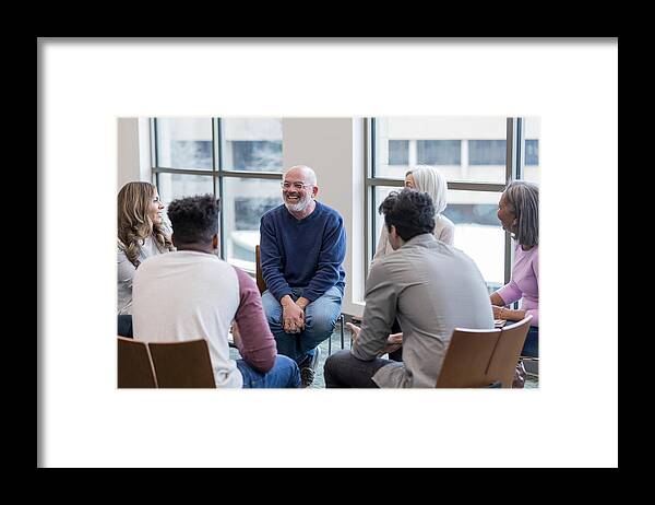 Expertise Framed Print featuring the photograph Diverse people sit in circle and brainstorm ideas by Asiseeit