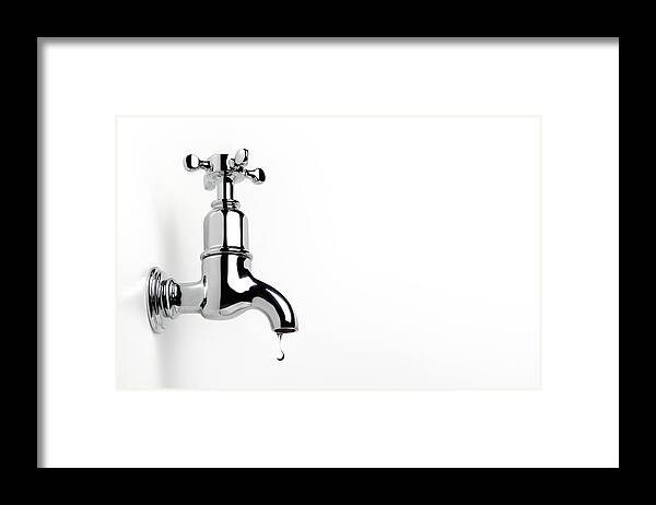 Environmental Conservation Framed Print featuring the photograph Dripping Tap With Copy Space by Peter Dazeley