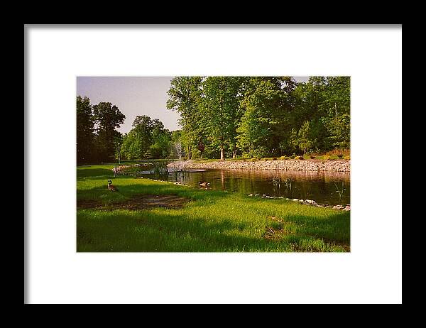 Ducks Framed Print featuring the photograph Duck Pond With Water Fountain by Chris W Photography AKA Christian Wilson