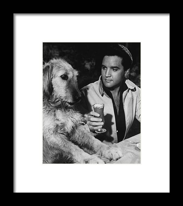 Classic Framed Print featuring the photograph Elvis Presley Has A Milkshake With Dog by Retro Images Archive