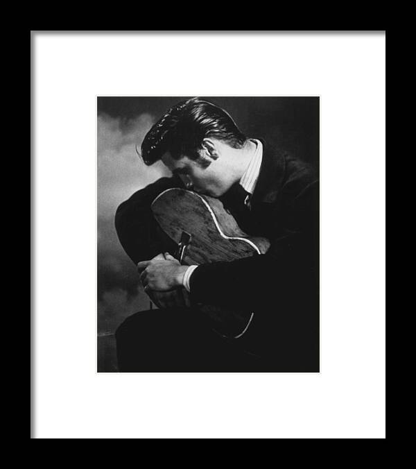 Classic Framed Print featuring the photograph Elvis Presley Kisses Guitar by Retro Images Archive