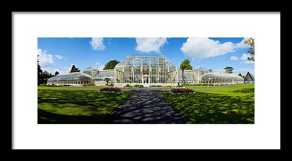 Photography Framed Print featuring the photograph Facade Of Curvilinear Glass House by Panoramic Images