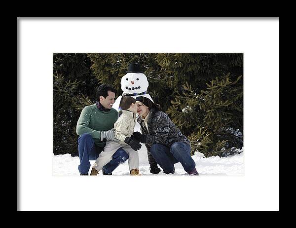 4-5 Years Framed Print featuring the photograph Family with snowman by Comstock Images