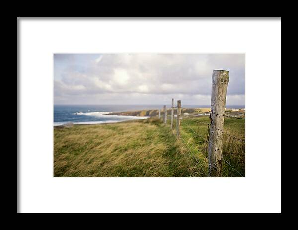 Tranquility Framed Print featuring the photograph Fenceline Along Hill Above Ocean And by Danielle D. Hughson