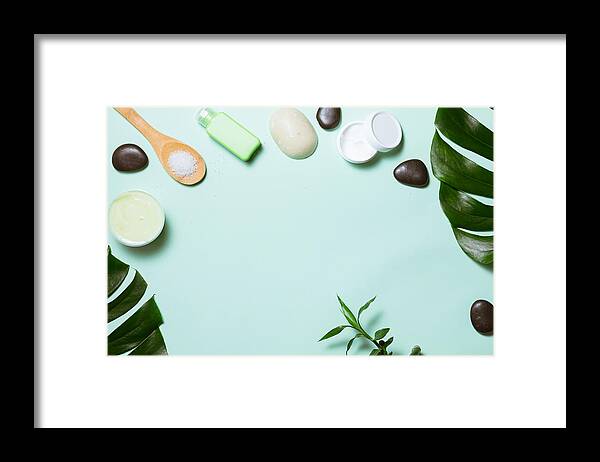 Spa Framed Print featuring the photograph Flat lay of spa cosmetic with bamboo, salt for bath, cream and towel on pastel background, top view mock-up by Amax Photo