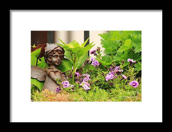 Angel Framed Print featuring the photograph Flower-bed mit an angel statue by Amanda Mohler