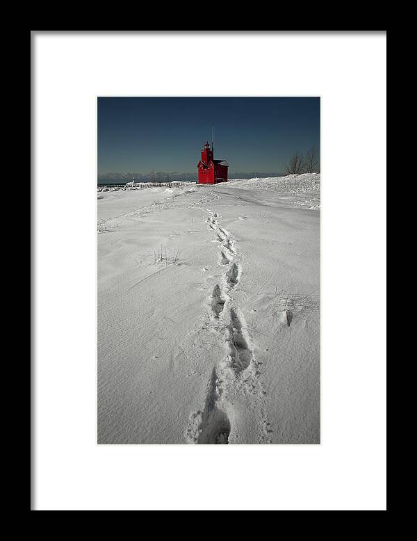 Art Framed Print featuring the photograph Footprints leading from the Lighthouse Big Red during Winter by Randall Nyhof
