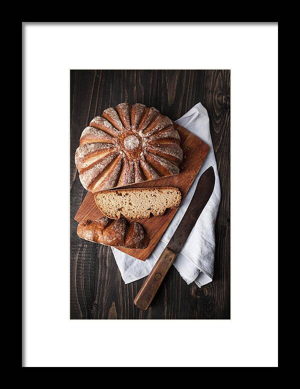 Cutting Board Framed Print featuring the photograph Fresh Baked Bread On Chopping Board by Westend61