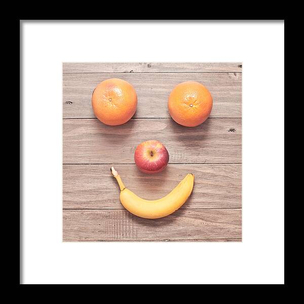 Amusing Framed Print featuring the photograph Fruit face by Tom Gowanlock