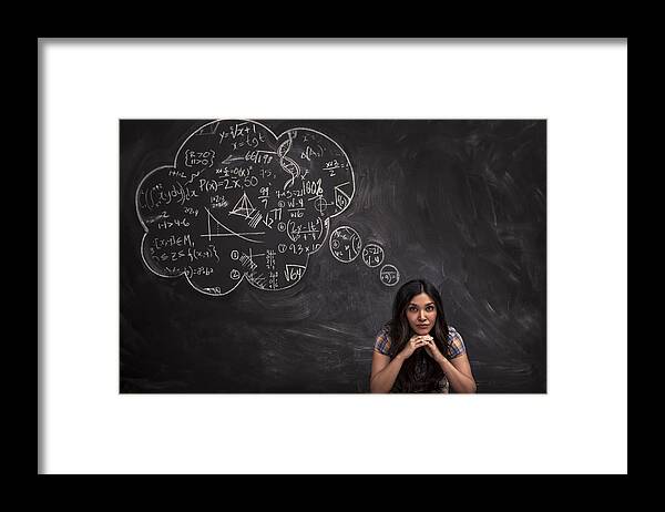 Focus Framed Print featuring the photograph Girl contemplates math thought bubble on chalkboar by Justin Lewis