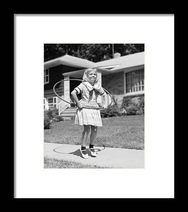 1950s Framed Print featuring the photograph Girl Hula-hooping, C.1950s by H. Armstrong Roberts/ClassicStock