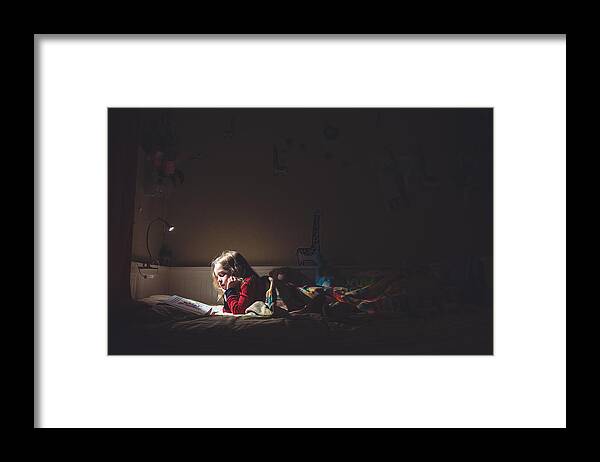 Child Framed Print featuring the photograph Girl reading in her bed at night by Teresa Short