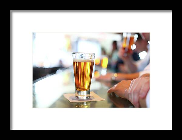 People Framed Print featuring the photograph Glass Of Beer At Bar by Marianna Massey