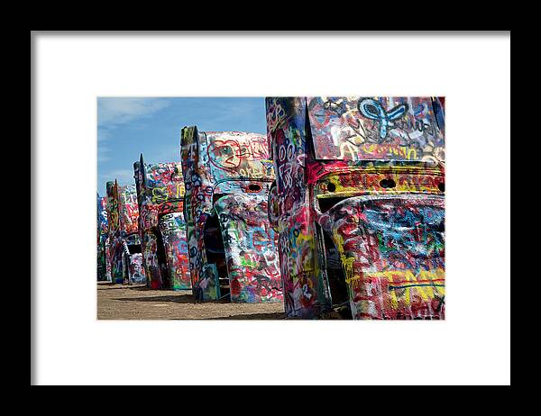 Cadillac Ranch Framed Print featuring the photograph Graffiti at the Cadillac Ranch Amarillo Texas by Mary Lee Dereske