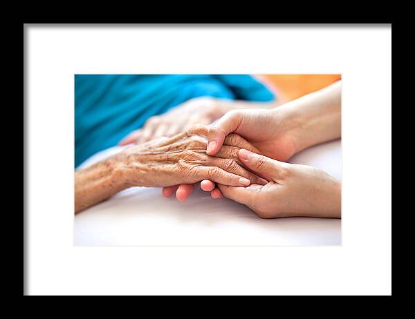 Mature Adult Framed Print featuring the photograph Helping the needy by Barcin