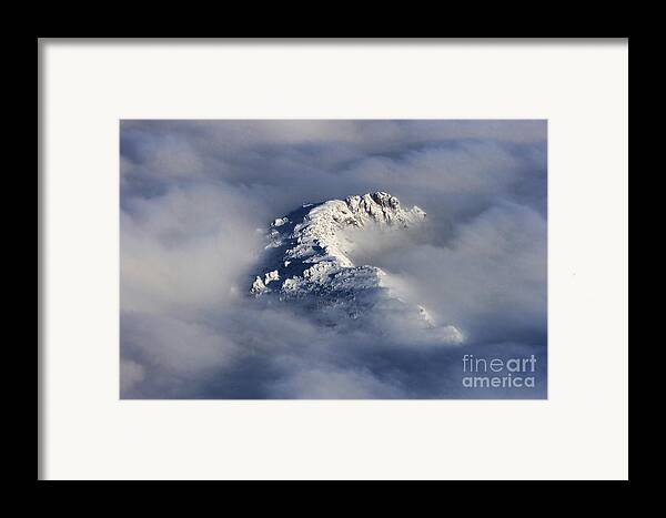 High Mountain Snow Caps Peaking Through The Clouds Framed Print by ...