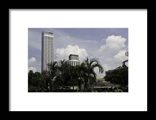 Action Framed Print featuring the photograph High rise buildings behind trees along with construction work in Singapore by Ashish Agarwal