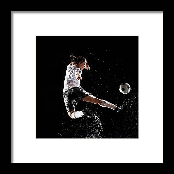 Soccer Uniform Framed Print featuring the photograph Hispanic Soccer Player Splashing In by Erik Isakson